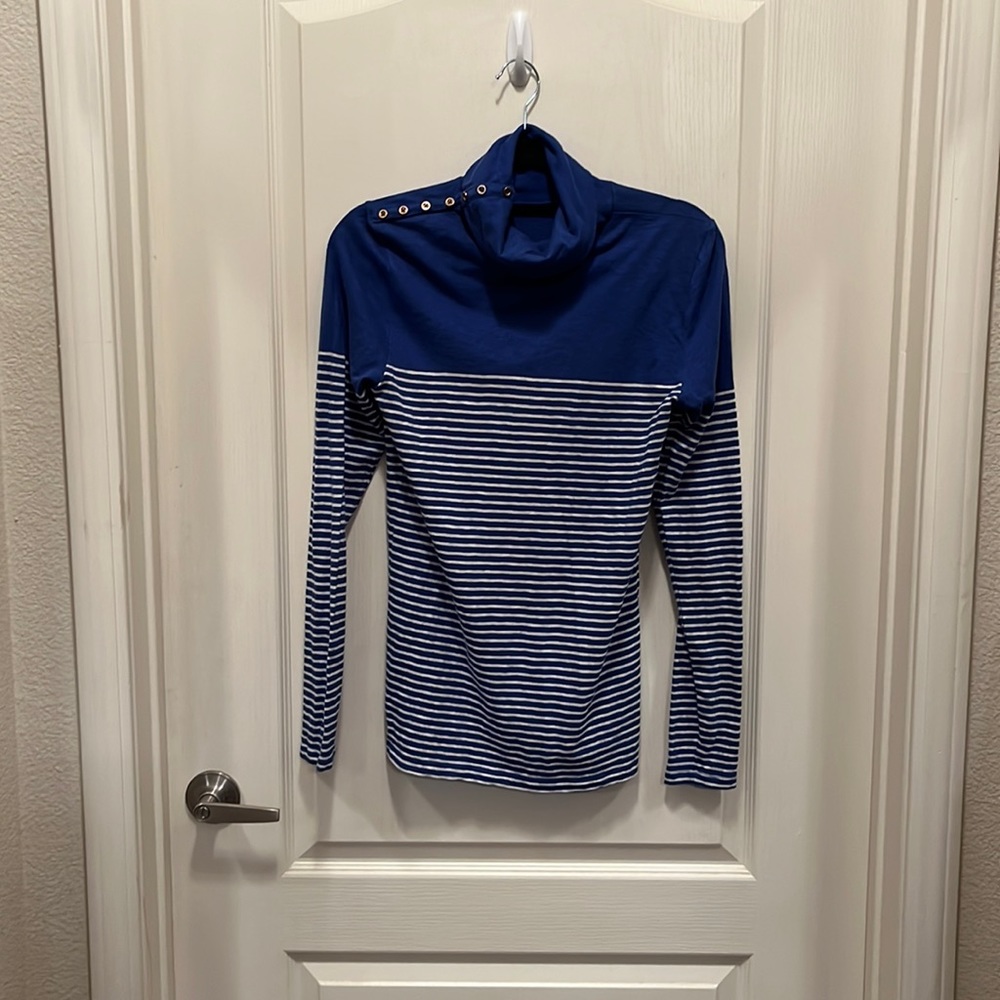 Blue and white 3/4 striped turtleneck with gold metal buttons on side of neck.